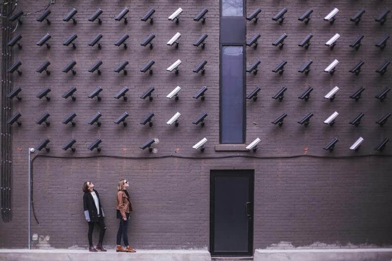 Two people looking at Outdoor Surveillance Cameras